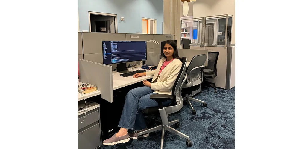Apoorva Singh working at her desk
