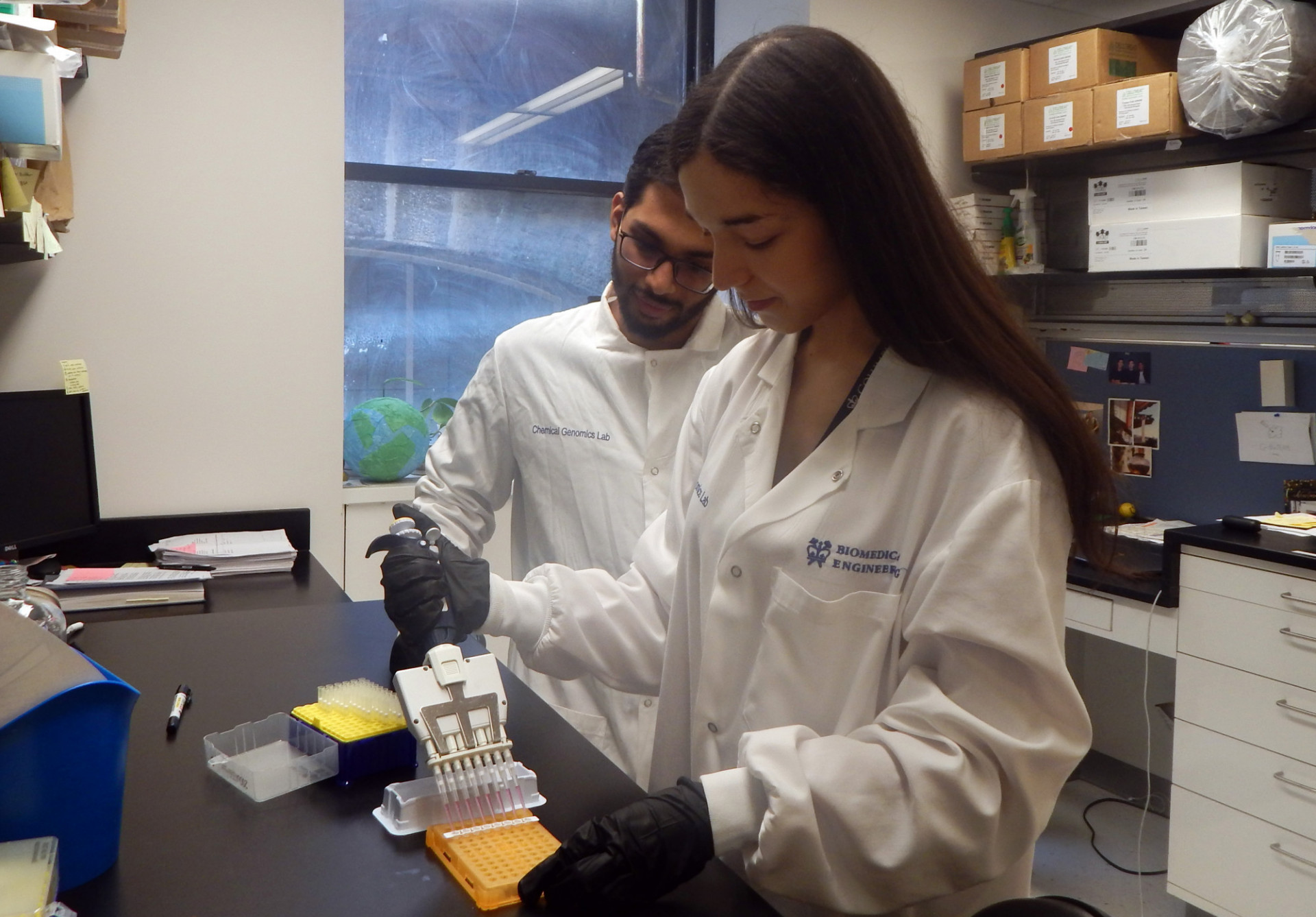Two people working in a lab