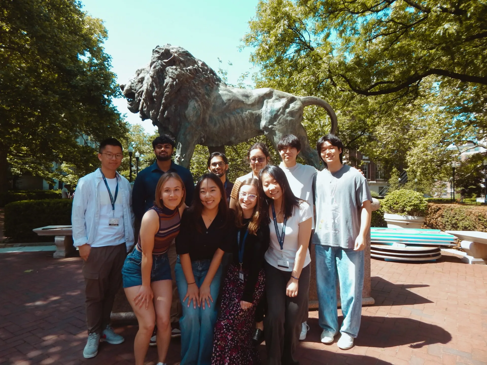10 SRP interns in front of the Scholar's Lion statue