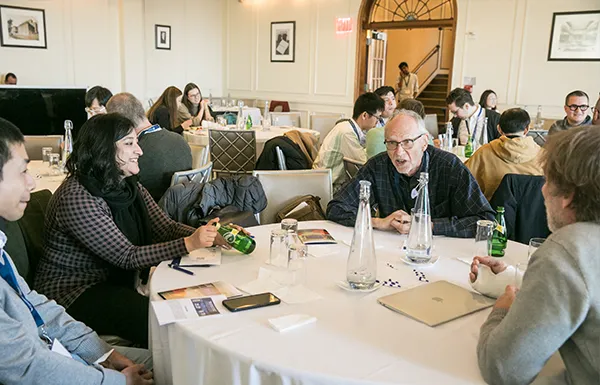 People chatting at a conference