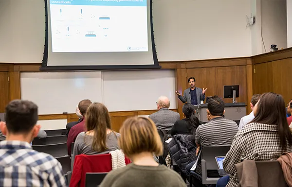 Speaker presenting in front of an audience