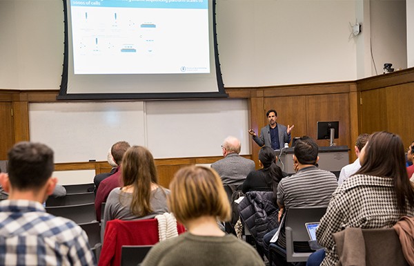 Speaker presenting in front of an audience