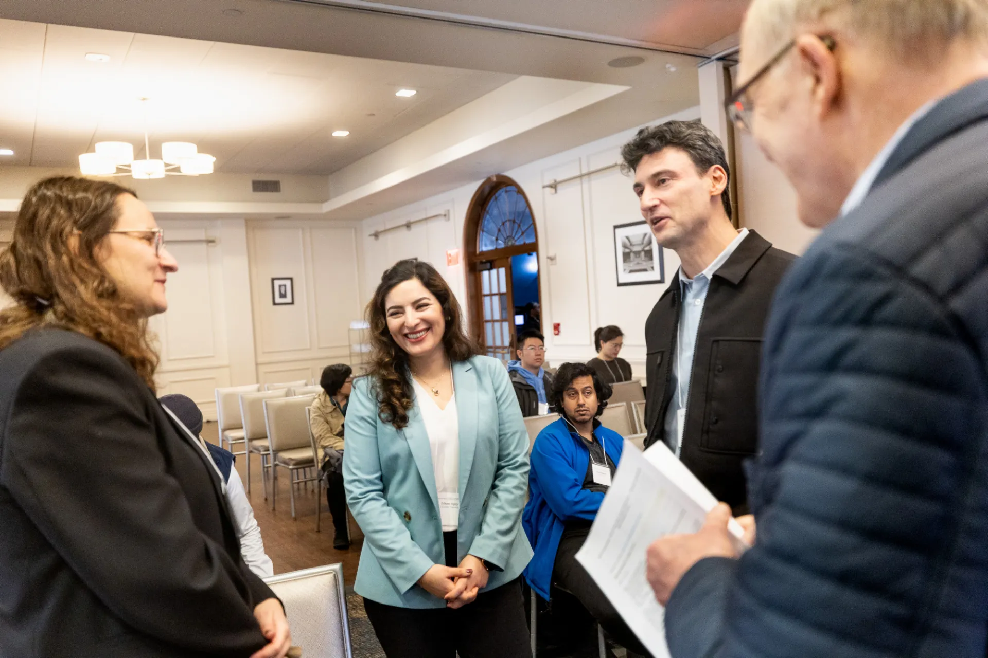Speakers Bianca Dumitrascu, Elham Azizi, and Itai Yanai chat with IICD Director Simon Tavaré as attendees arrive at the IICD Symposium.