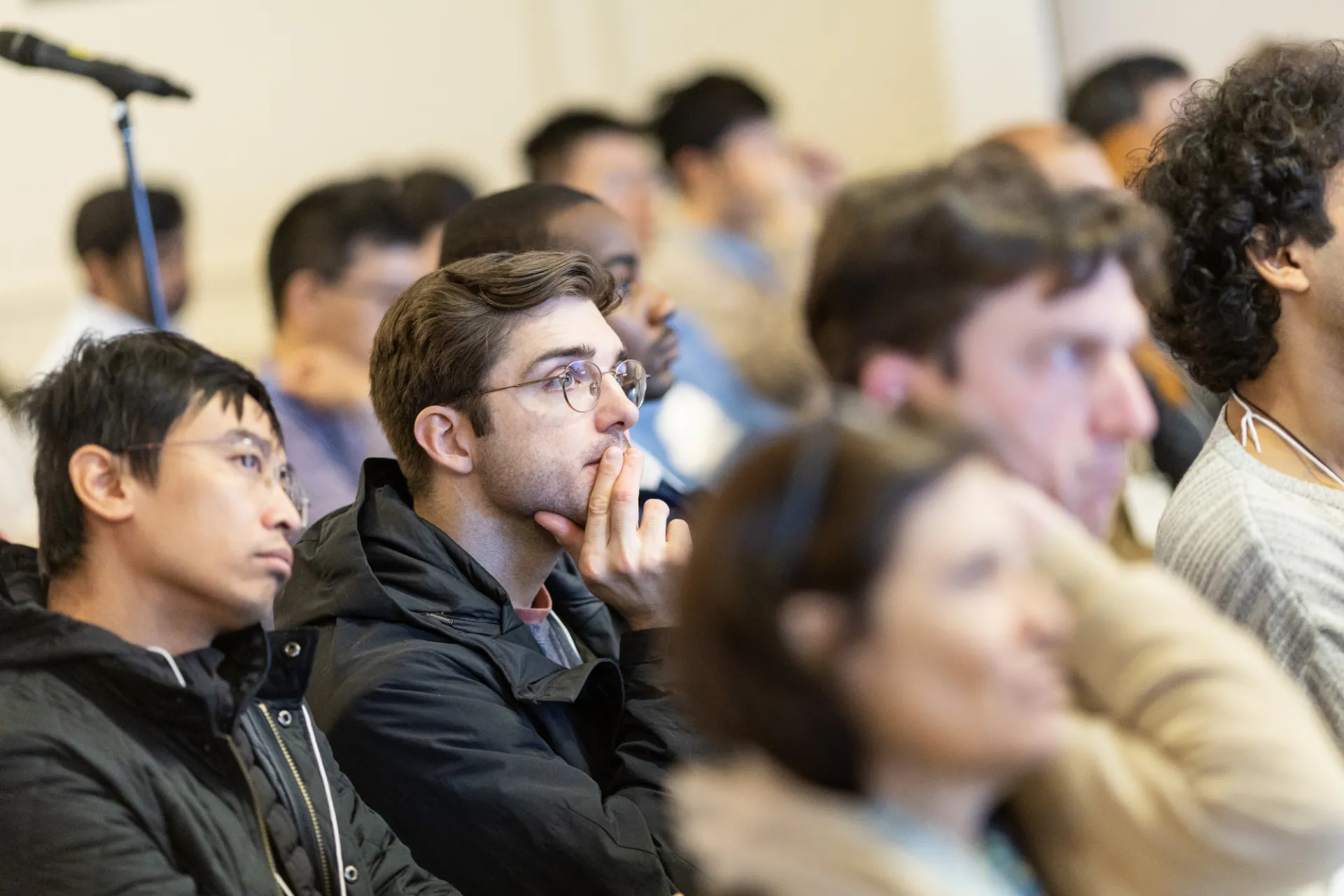 A photo of seated attendees of the 2026 IICD Symposium listening thoughtfully to a presentation.