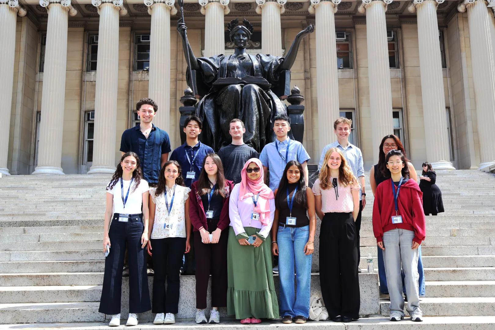 2026 SRP interns stand in front of Alma Mater statue at Columbia University.