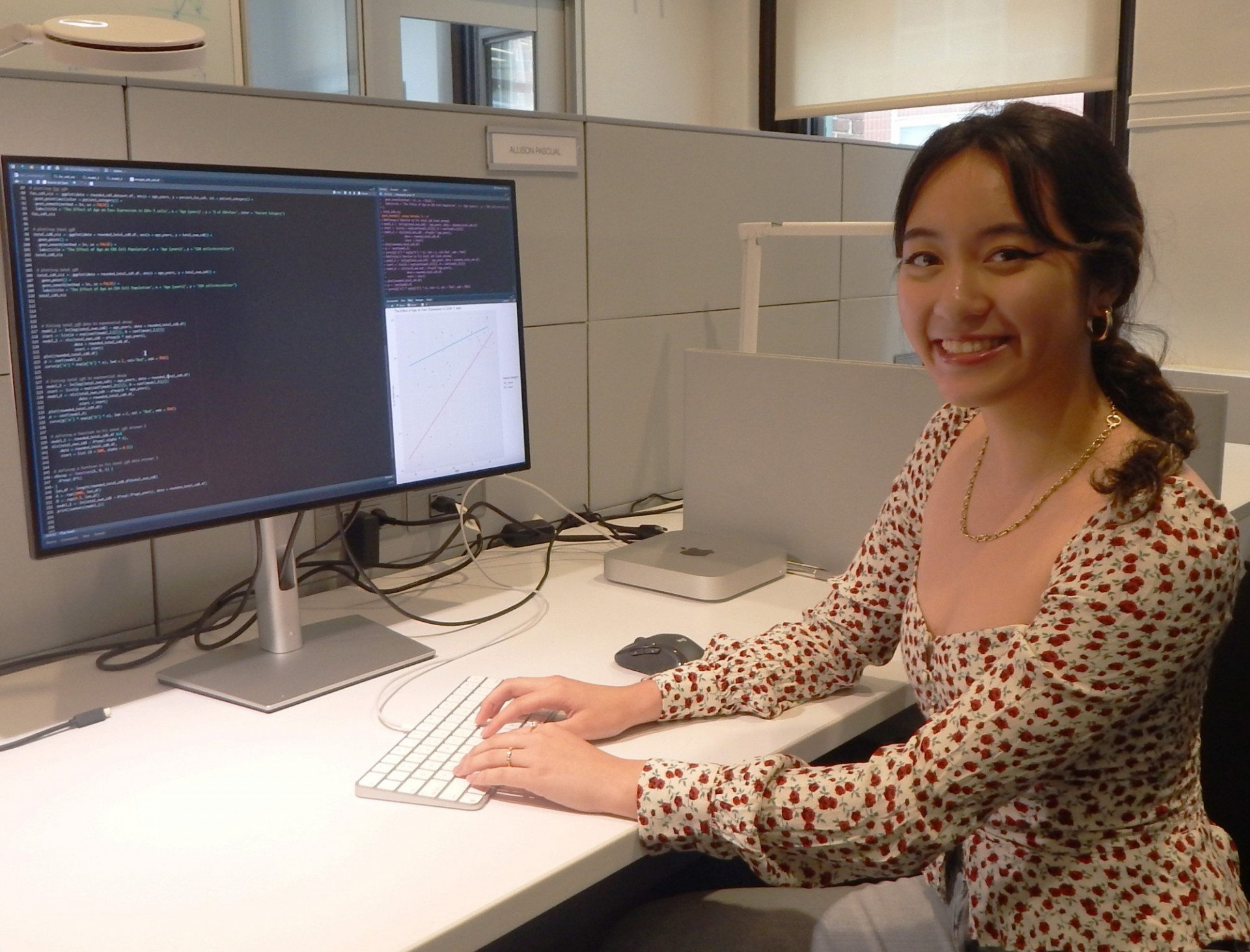 Image of a woman in front of computer